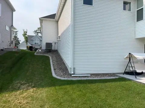 Concrete border with rocks along driveway in Princeton, MN