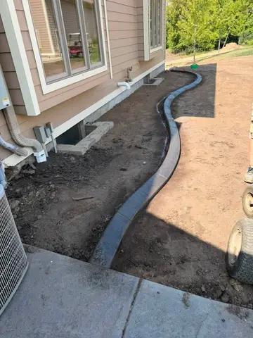 Concrete border along foundation with landscaping in Princeton, MN