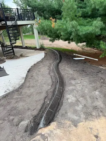 Landscaped area with tree and flowers in Princeton, MN