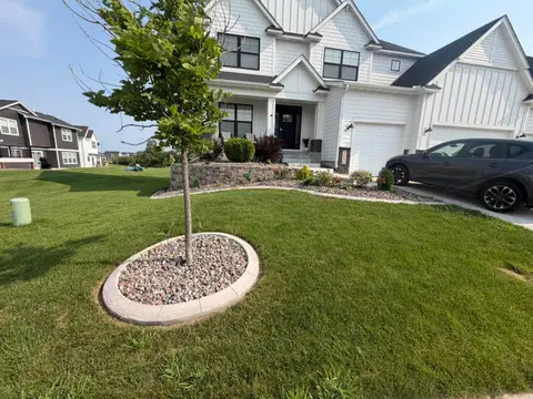 Concrete edging under deck with flower beds in Princeton, MN